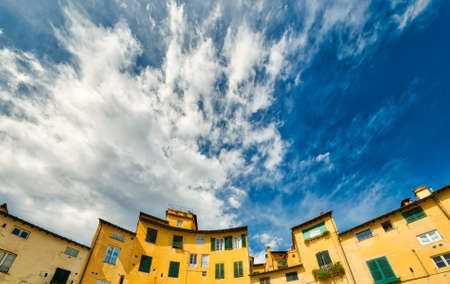 ancient buildings on the main square of Lucca, rare preserved wonder of medieval architecture in Italyの写真素材