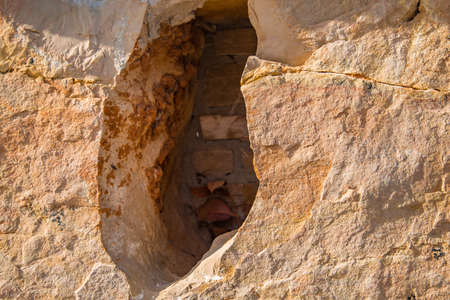 background of grunge stone wall with large holeの写真素材