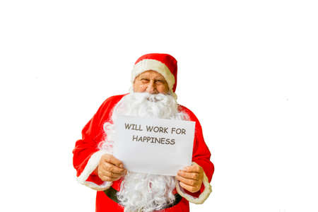 Santa Claus showing signboard with sentence will work for happiness isolated on white backgroundの写真素材