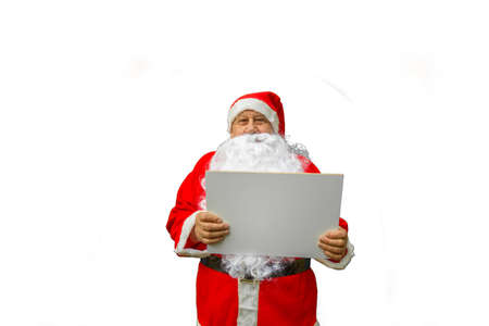 Santa Claus showing blank signboard isolated on white backgroundの写真素材