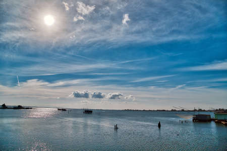 fishing huts with balance netfish in the lagoon of the valleys of Comacchio in Emilia Romagnaの写真素材