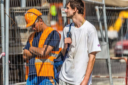 BUDAPEST, HUNGARY - SEPTEMBER 17, 2014: worker rests behind wire mesh. Thanks to investments in public works too, every year the number of tourists visiting Budapest increases.のeditorial素材