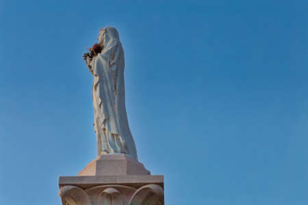 statue of The Blessed Virgin Mary on blue sky backgroundの写真素材