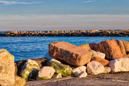 rocks along pier on Adriatic coast in Italyの写真素材