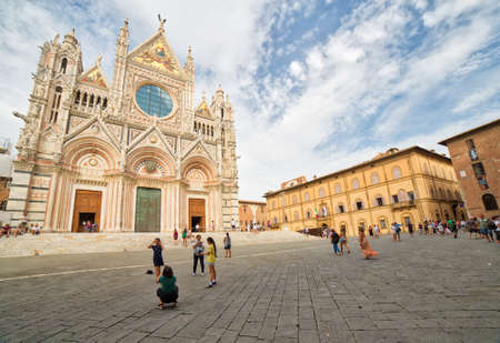 SIENA, ITALY - AUGUST 28, 2017: tourists visit the Cathedral of Siena during summer holidaysのeditorial素材