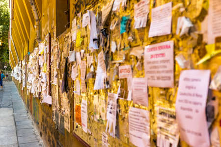 BOLOGNA, ITALY - AUGUST 27, 2016: College students still use physical bulletin boards to publish their adsのeditorial素材