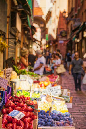 BOLOGNA, ITALY - AUGUST 27, 2016:  tourists and locals go shopping in medieval market. The trade vocation of this area known as Quadrilatero, meaning The Quadrilateral Area, was born in Middle Agesのeditorial素材