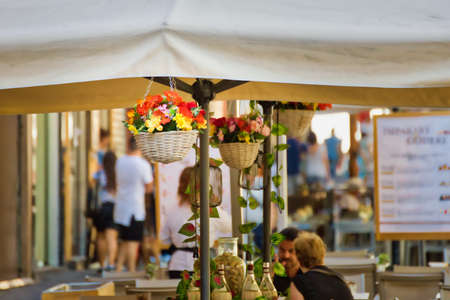 BOLOGNA, ITALY - AUGUST 27, 2016:  tourists and locals enjoy breakfast in the old market. The trade vocation of this area known as Quadrilatero, meaning The Quadrilateral Area, was born in Middle Agesのeditorial素材