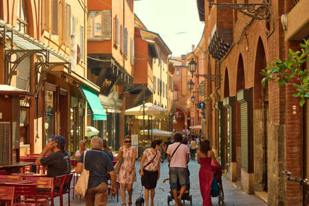 BOLOGNA, ITALY - AUGUST 27, 2016:  tourists and locals go shopping in the medieval market. The trade vocation of this area known as Quadrilatero, meaning The Quadrilateral Area, was born in Middle Agesのeditorial素材