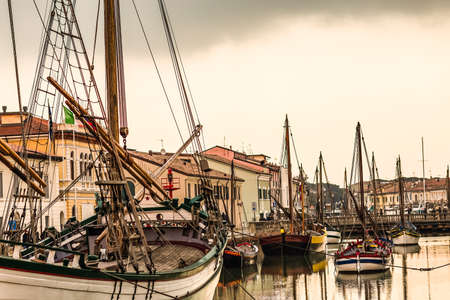 Historical boats moored in the canal port of Cesenatico