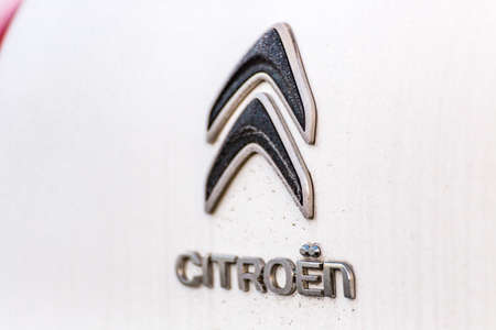 LUGO (RA) - FEBRUARY 14, 2018: Moisture and dirt cover the Citroen logo of a white car. PSA owner of the Citroen brand is the second automaker in Europeのeditorial素材