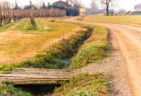 country dirt road and ditch on a cold winter morning