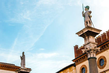 RAVENNA, ITALY - FEBRUARY 15, 2018: the statues of Saint Vitale and Saint Apollinaris  rise in Piazza del Popoloのeditorial素材