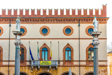 RAVENNA, ITALY - FEBRUARY 15, 2018: The town hall of Ravenna shows the banner to ask the truth about...