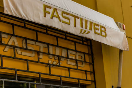 RAVENNA, ITALY - FEBRUARY 15, 2018: FASTWEB sign of street shop. The Italian finance guard inspects...