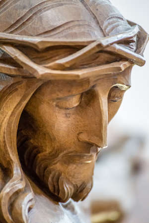 closeup of wooden statue of Jesus Christ with crown of thornsの写真素材