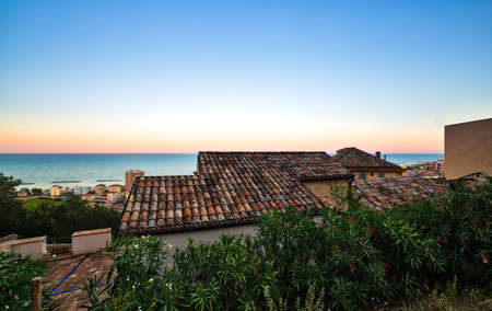 roofs of picturesque village on the sea in Italyの写真素材