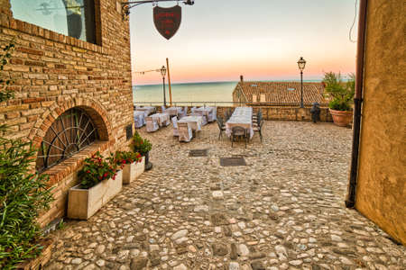 GROTTAMMARE (AP) - AUGUST 24, 2018: Tables are prepared to receive tourists for dinnerのeditorial素材