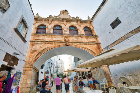 OSTUNI (BR), ITALY - AUGUST 29, 2016: The mayor issued the Ordinance to whitewash the facades of the houses with lime milk to keep the historic whiteness of Ostuniのeditorial素材