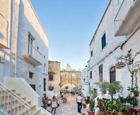 OSTUNI (BR), ITALY - AUGUST 29, 2016: The mayor issued the Ordinance to whitewash the facades of the houses with lime milk to keep the historic whiteness of Ostuniのeditorial素材