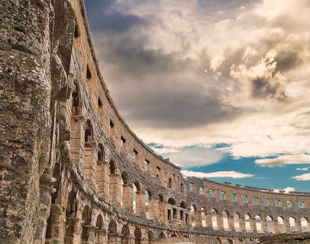 cloudy sky on Roman amphitheatre similar to Colosseum of Romeの写真素材