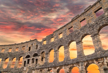 sunset on Roman amphitheatre similar to Colosseum of Romeの写真素材