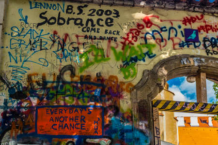 PRAGUE, CZECH - AUGUST 28, 2014: the Lennon wall is a symbol for young people who keeps on drawing graffiti inspired by John Lennon and Beatles lyricsのeditorial素材