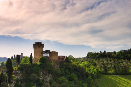 Fortress and Catholic Shrine in Italian hillsideの写真素材