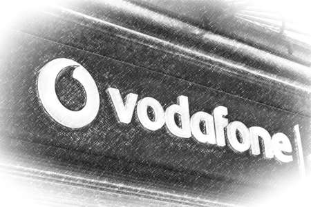 RAVENNA, ITALY - FEBRUARY 15, 2018: VODAFONE logo. The Italian finance guard inspects the headquarters of VODAFONE for arrangements against competition for monthly billing. illustrationのeditorial素材