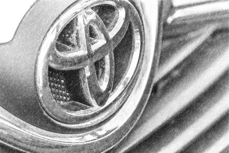 RAVENNA, ITALY - FEBRUARY 15, 2018: dirt covers the Toyota logo. Toyota is to stop producing cars powered by diesel engines. Illustrationのeditorial素材