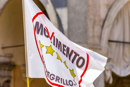 FAENZA (RA), iTALY - JUNE 9, 2018: The wind moves the flag of the Italian political party Movimento Cinque Stelle. Their new Italian government has been confirmed by the Parliamentのeditorial素材