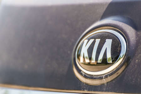 RAVENNA, ITALY - JUNE 10, 2018: Dirt and dust cover the KIA logo on a car bodyのeditorial素材