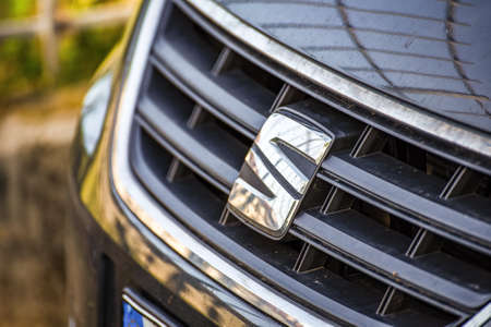 RAVENNA, ITALY - JUNE 9, 2018: Dirt and dust cover the SEAT logo on a car bodyのeditorial素材