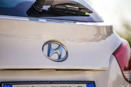 RAVENNA, ITALY - JUNE 9, 2018: Dirt and dust cover the HYUNDAI logo on a car body