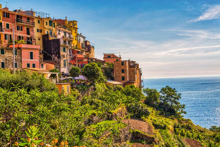 colorful houses overlooking the sea in Italian Five Landsの写真素材