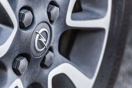 RAVENNA, ITALY - JUNE 30, 2018: Dirt and dust cover the OPEL logo on an alloy wheelのeditorial素材