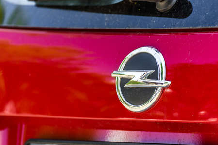 RAVENNA, ITALY - JUNE 30, 2018: Dirt and dust cover the OPEL logo on a car body
