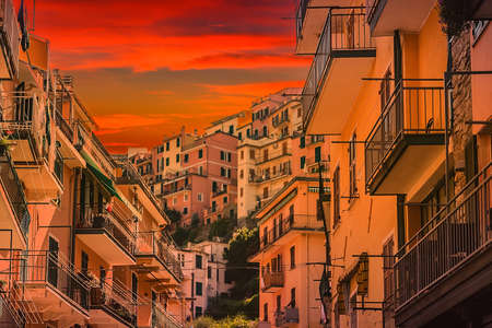 sunset on colorful houses in Italian town