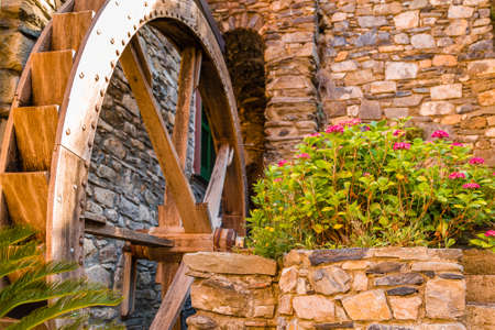 Wooden Wheel of Old Millの写真素材