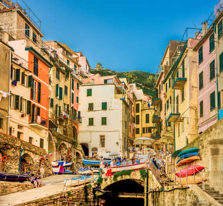 RIOMAGGIORE (SP), ITALY - JUNE 19, 2018: tourists are walking on promenade of marinaのeditorial素材