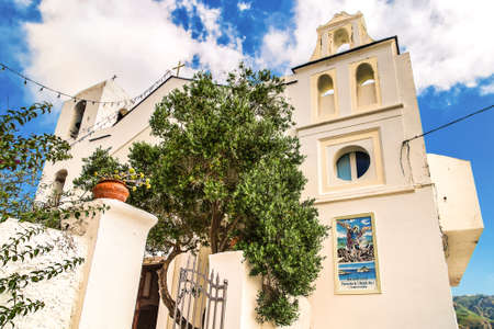 San Angelo Ischia (NA), Italy - September 19, 2018: sun lights church facade with picture of Saint...