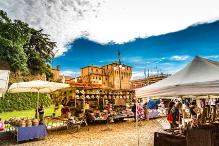 LUGO (RA), ITALY - JUNE 5, 2013: people are going for shopping in stalls of weekly marketのeditorial素材