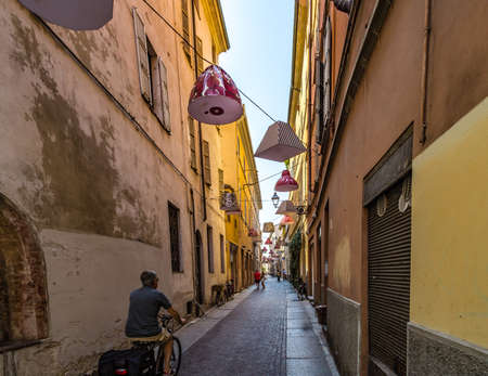 PARMA, ITALY â€“ AUGUST 23, 2018: Tourists are walking and enjoying the charming historic...