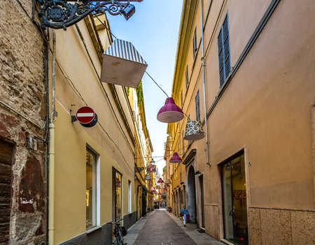 PARMA, ITALY â€“ AUGUST 23, 2018: Tourists are walking and enjoying the charming historic...