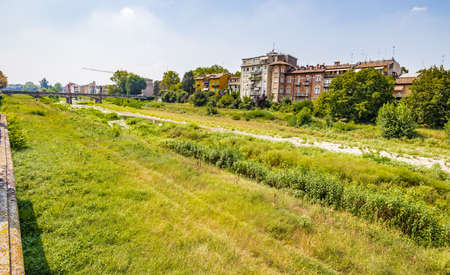 ancient buildings along creek in Parma, elegant town in the Emilia-Romagna region of Northern Italyの写真素材