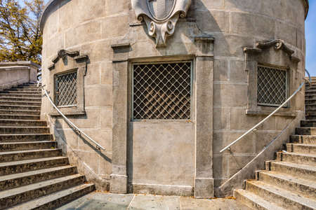 stone double staircase around rounded ancient buildingの写真素材