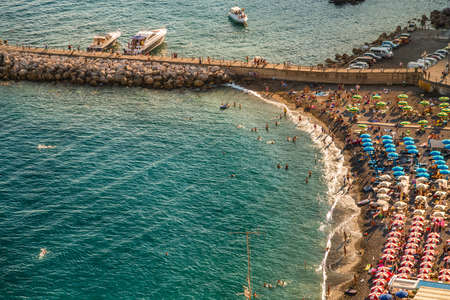 AMALFI (SA), ITALY - AUGUST 28, 2018: tourists walking  on the seaside of Amalfiのeditorial素材