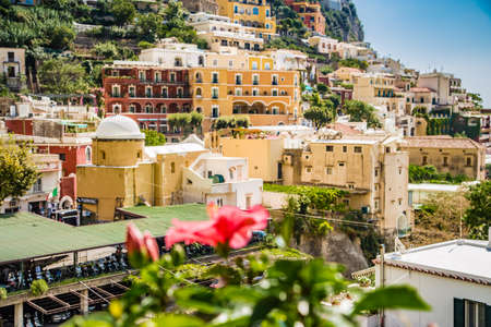 Red Hibiscus flower on Amalfi panoramaの写真素材