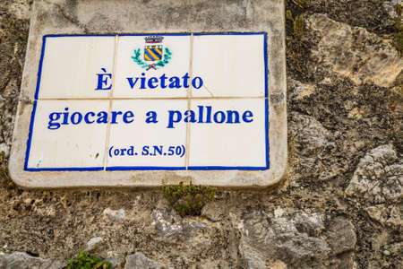 PRAIANO (SA), ITALY - AUGUST 31, 2018: dirt and dust covering ancient board banning soccerのeditorial素材