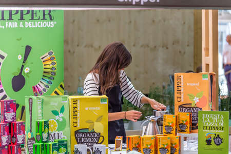 BOLOGNA (ITALY), SEPTEMBER 10, 2018: Booth presenter awaiting visitors to give information about the...